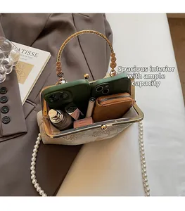 Detail view showing large capacity of the vintage pearl embroidered crossbody bag