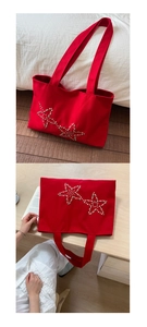 Detail of red canvas tote bag with pearl star patterns and spacious interior design