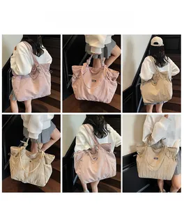 Detailed views of nylon tote bags in pink and beige with knotted straps and side drawstrings