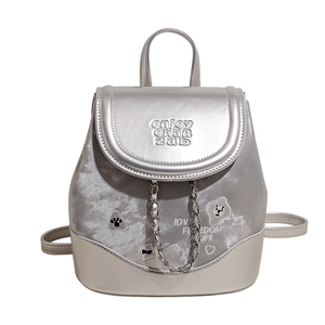 Silver metallic backpack with velvet patchwork and bear embroidery shown in full view