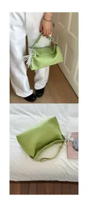 Detail of light green litchi texture leather bag with lace bow and pearl pendant charm