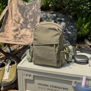 Olive green hiking backpack in nylon material for camping and outdoor activities