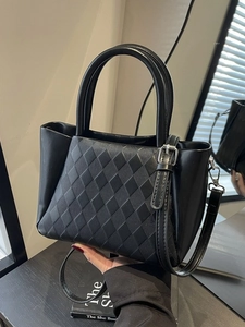 Chic black quilted bucket bag with leather handles and silver hardware for daily wear