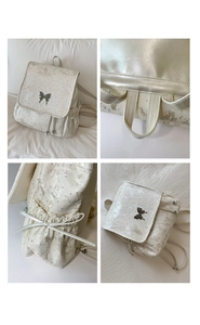 Detailed views of floral backpack with silver butterfly clasp and drawstring side bows