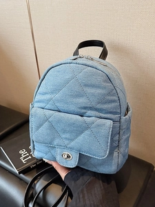 Chic quilted denim mini backpack in light blue with silver twist lock and chain strap