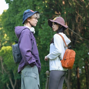 Detail of lightweight UPF 50+ sun protection jacket and outdoor nylon backpack in nature