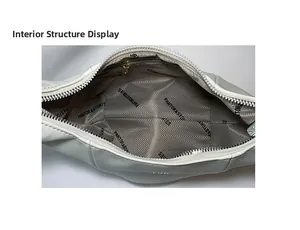 Internal view showing spacious main compartment and zipper pocket of the white bag