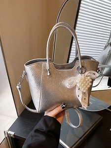 Silver metallic bucket bag with pearl heart charm and ribbon detailing for women
