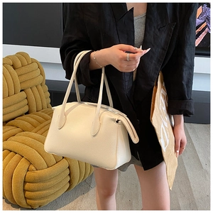 Chic beige lychee grain leather tote bag shown with model for daily commute style