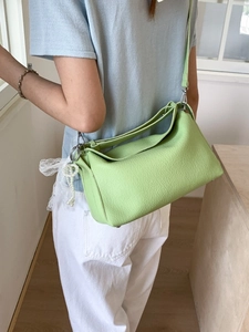 Light green dumpling bag in lychee leather with lace bow and pearl charm for women