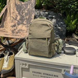 Detailed view of durable ripstop nylon outdoor backpack on a camping storage box