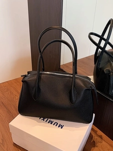 Black lychee leather tote bag with large capacity and silver zippers for commuting