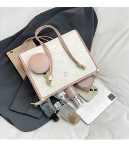 Spacious tote bag interior view showing large capacity for tablets and cosmetics