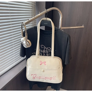 Close-up of white JK style tote with pink bow and floral embroidery on shiny leather