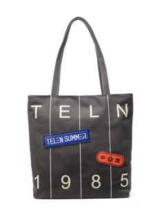 Dark grey canvas tote bag with TELN 1985 print and vintage patches on white background