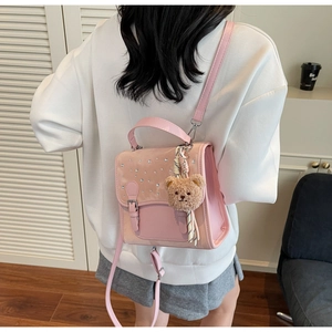 Pink patchwork backpack with sequins and cute brown teddy bear plush keychain charm
