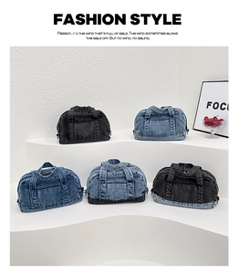 Detailed arrangement of denim pillow bags in black and blue hues on a white display stand