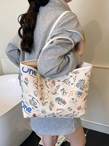 Off-white graffiti tote bag with colorful hand-drawn prints for stylish daily commuting