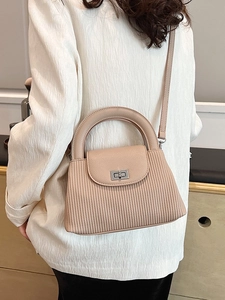 Beige pleated texture crossbody bag with silver lock and top handle for women