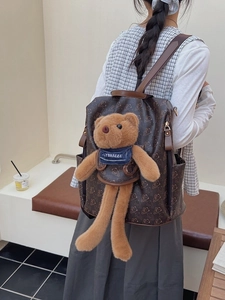 Vintage bear pattern backpack in dark brown PU leather with a cute plush bear charm