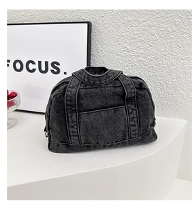 Detailed view of dark grey washed denim handbag with unique shirt collar top design