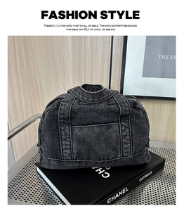 Detailed view of the black denim handbag featuring jacket-inspired lapels and pockets