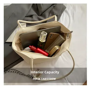 Detail view of large capacity tote bag interior with cosmetics and daily essentials