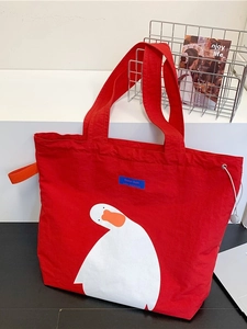 Red canvas tote bag featuring a cute white goose print with side drawstring and top handle