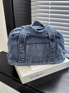 Large capacity blue denim pillow handbag with washed texture and dual top handles