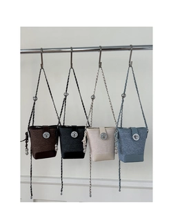 Detailed comparison of four stylish tweed bucket bags in brown, black, white, and grey blue