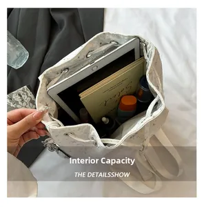 Internal capacity of the star pattern canvas backpack showing tablet and cosmetics