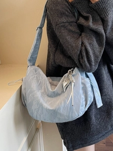 Light blue pleated dumpling shoulder bag for women with silver heart pendant