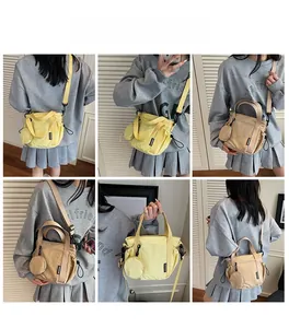 Detailed views of casual canvas crossbody bag with small round coin pouch attachment