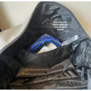Detail view of dry-wet separation pocket with inner zipper inside the travel bag