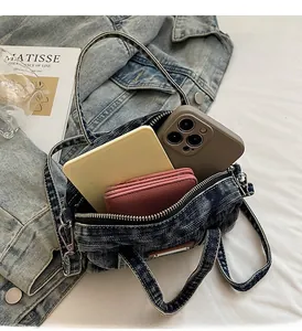 Internal storage view of vintage denim bowling bag showing space for phone and wallet