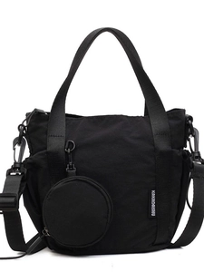 Versatile black canvas bucket bag with adjustable shoulder strap and round coin purse