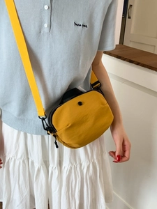 Minimalist ginger yellow nylon crossbody bag with adjustable fabric strap for women