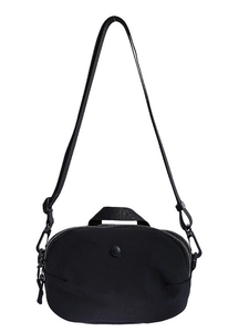 Elegant black nylon crossbody bag with dual zippers and adjustable shoulder strap