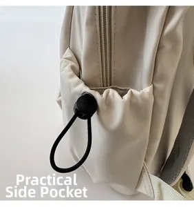 Close-up of practical elastic drawstring side pocket on beige nylon backpack