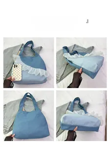 Detailed interior and base view of large denim tote bag with white ruffle lace trim