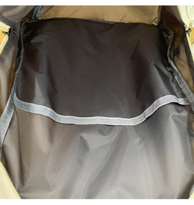 Macro view of the internal storage compartment with elastic divider in nylon backpack