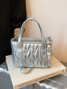 Silver quilted matelassé bucket bag with rhinestones and adjustable strap for women