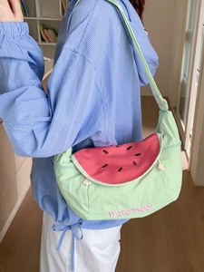 Green canvas watermelon crossbody bag with pink embroidery and adjustable strap