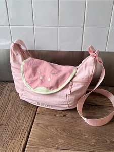 Pink nylon crossbody bag with watermelon slice design and adjustable shoulder strap