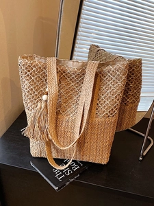 Chic hollow out straw shoulder bag with tassel pendant and woven handles for beach