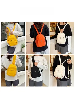 Détail du mini sac à dos en nylon montrant le tissu imperméable et les portés variés