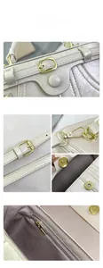 Detail view of pearl texture handbag featuring gold metal buckle and inner zipper pocket
