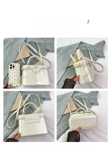 Multi-angle view of cream leather box bag with gold buckles and adjustable strap