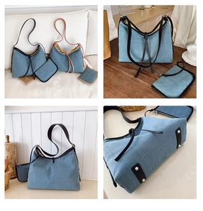 Detail of denim tote bag showing metal feet, drawstring closure and matching small pouch