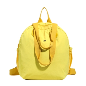 Waterproof yellow macaron backpack made of lightweight nylon with wide straps for travel